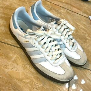 Light blue and white adidas sambas